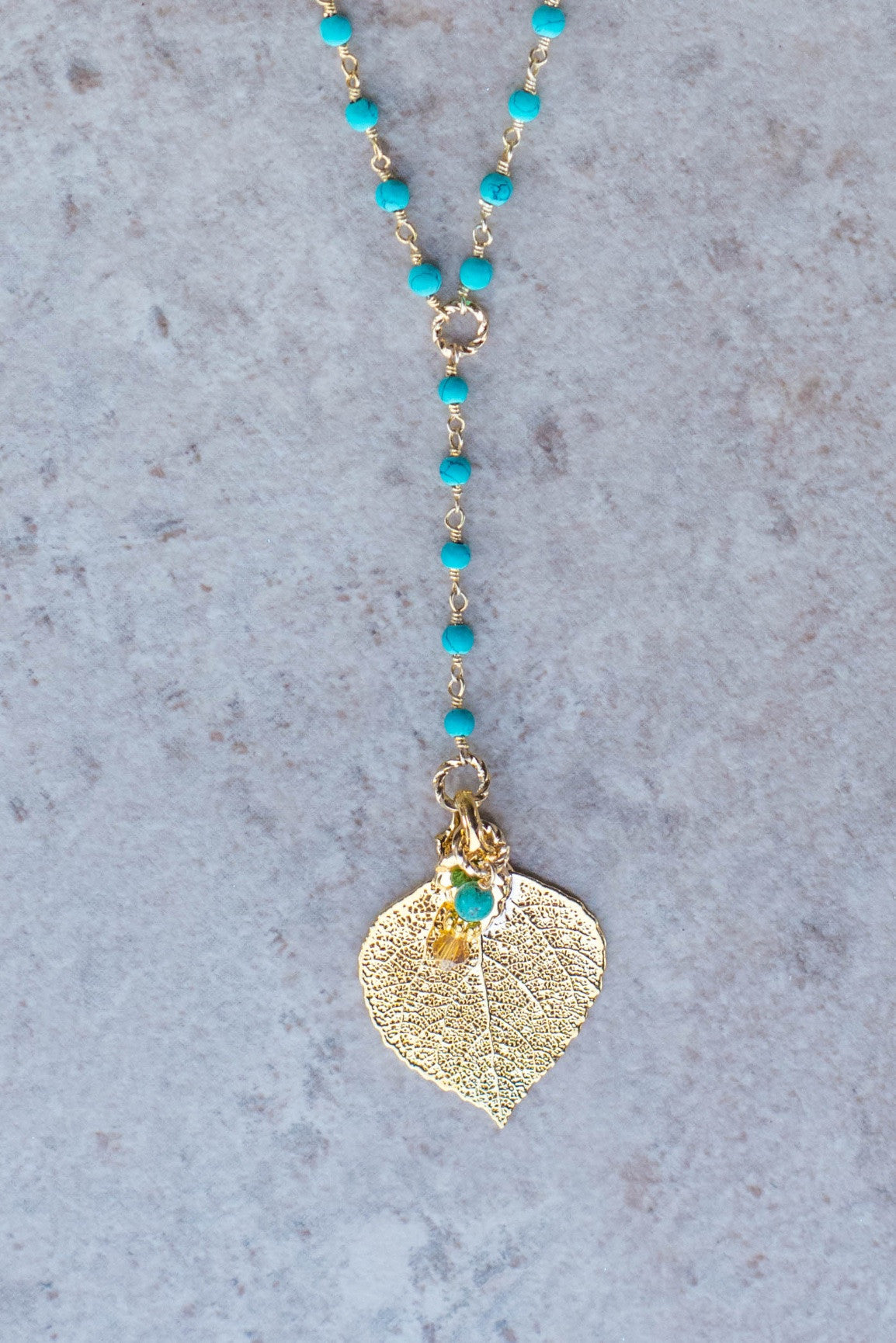 Gold leaf & Turquoise long Y style necklace.