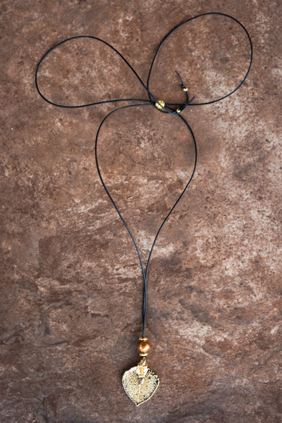 One Bronze pearl, Gold leaf,black cord, and Bronze pearl dangle