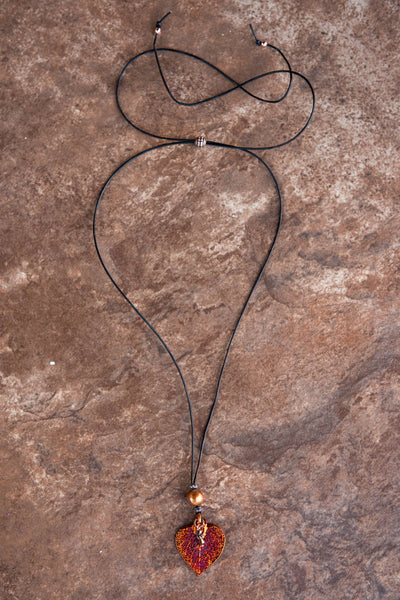One Bronze pearl, Copper leaf,black leather  cord and bronze pearl dangle