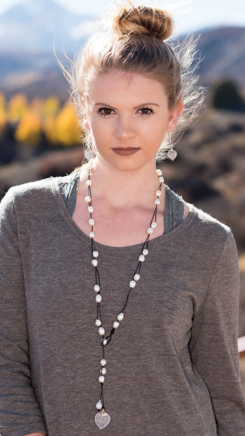 Lariat: Multi pearls accent this impressive necklace, White freshwater pearls, Gold Aspen leaf, black cord leather.