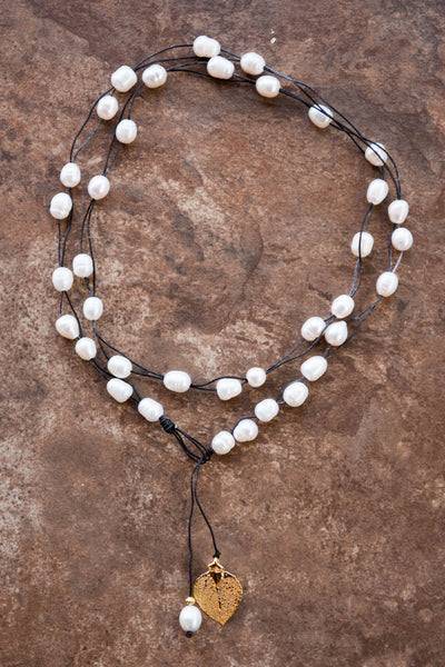Lariat: Multi pearls accent this impressive necklace, White freshwater pearls, Gold Aspen leaf, black cord leather.