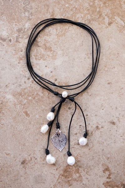 Lariat: Six pearls accent this amazing necklace, White freshwater pearls, silver Aspen leaf, black cord leather.