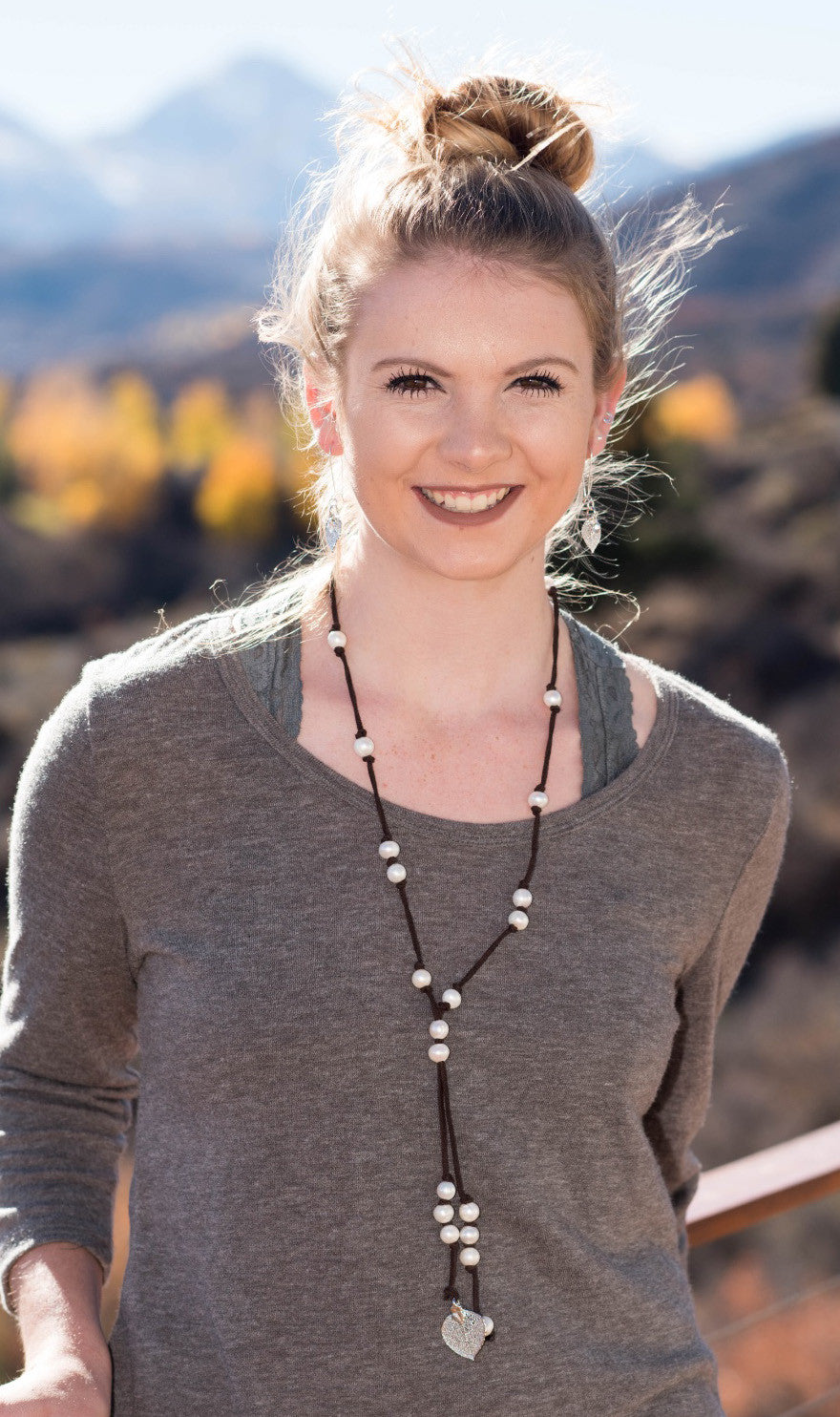 White fresh water pearls accent this stunning silver Aspen leaf, brown leather necklace.