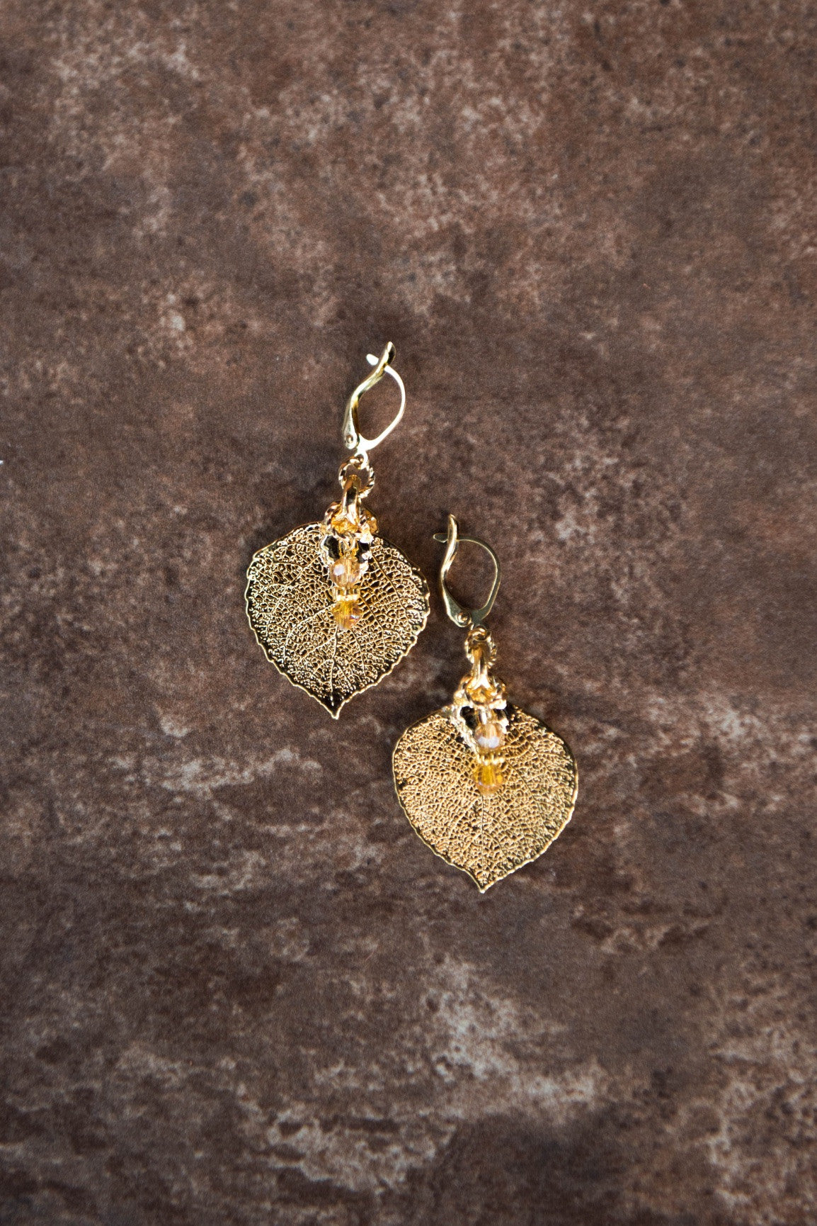 Gold earrings:  Our classic gold leaf earrings with crystal dangles complete with hinge hardware.